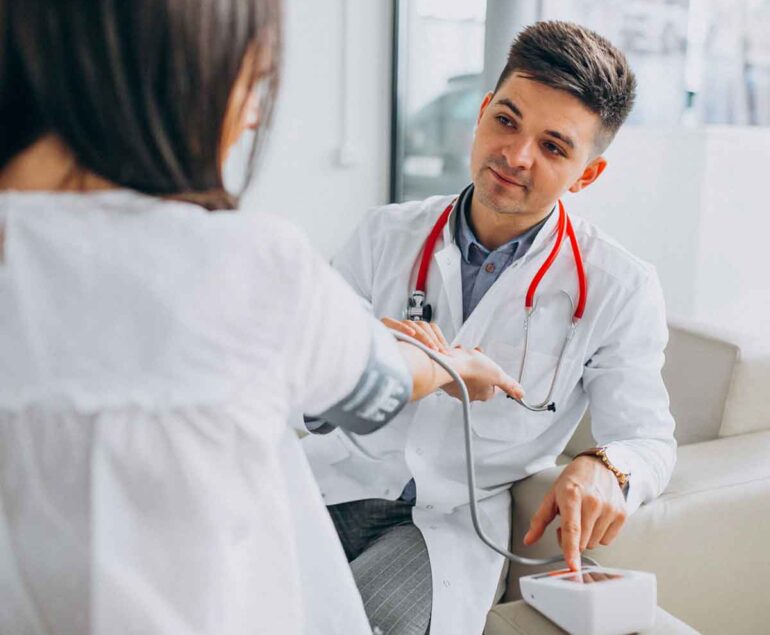 Doctor listens attentively to a patient during consultation.